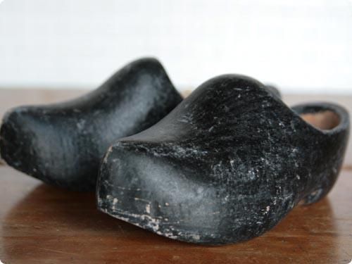 ڷ
